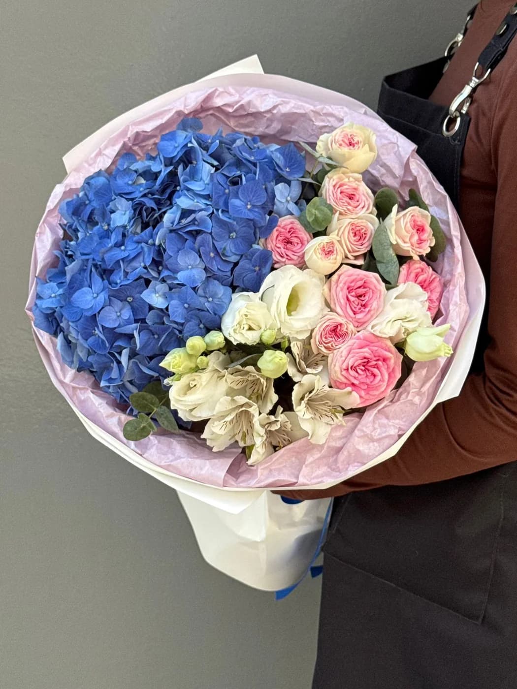 Mixed bouquet of spray roses Gelato, eustoma, alstroemeria, and hydrangeas.