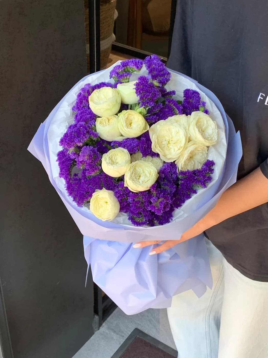 Duo bouquet of White Piano spray roses and Statice