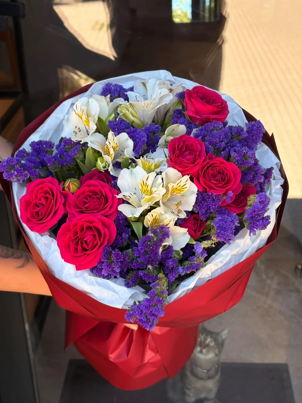 Mixed bouquet of Gem Star spray roses, white alstroemeria and blue statice.