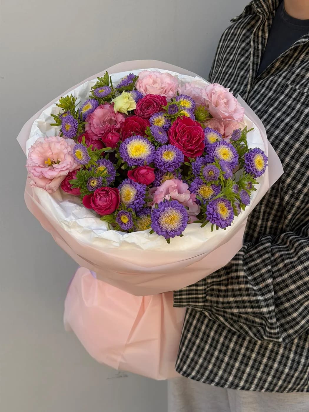 Mixed bouquet of Purple Silva spray roses, asters, and lisianthus