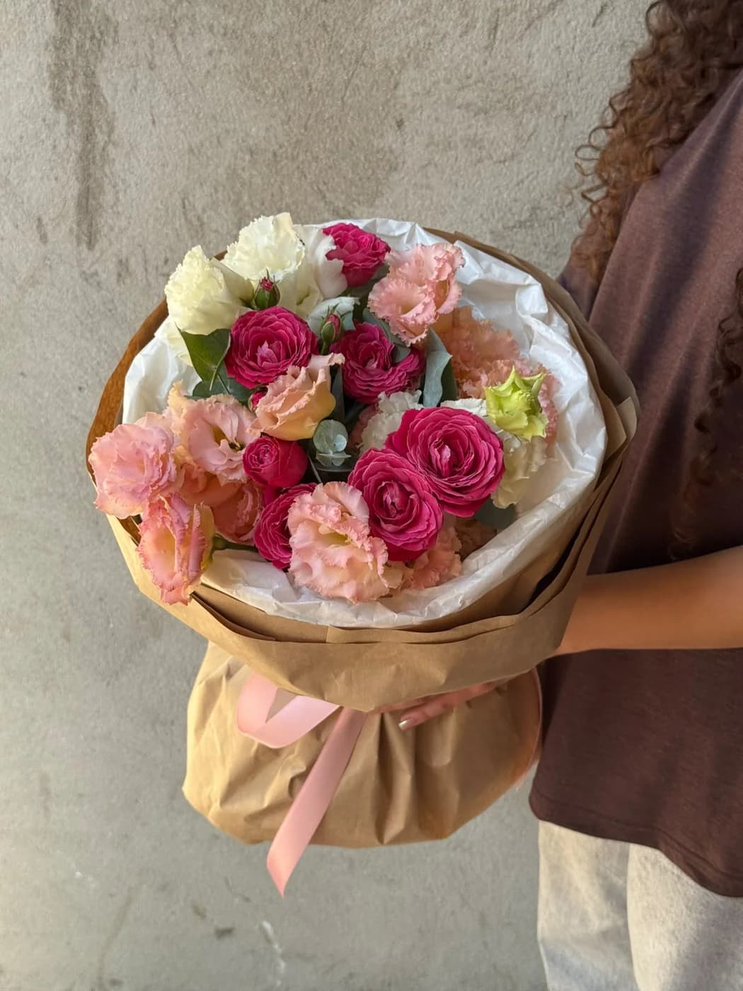 Mix bouquet of white eustoma, peach eustoma and purple silva.