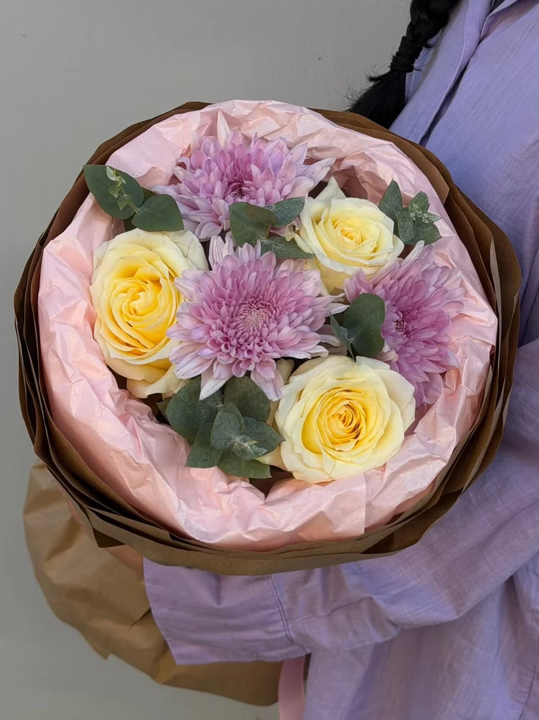 A duo bouquet made with candle light roses and pink chrysanthemum