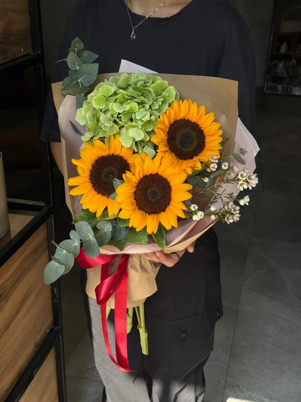 Mix bouquet with green hydrogen,wax flower and sunflower